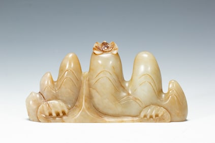 A CARVED JADE BRUSHREST