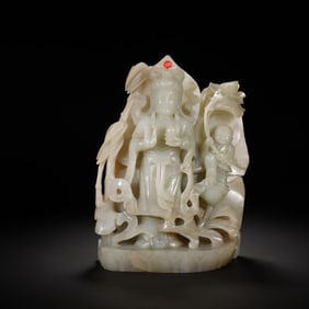 A CARVED WHITE JADE STANDING GUANYIN
