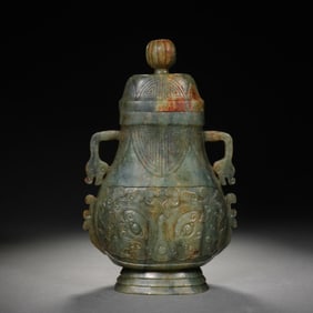 A CARVED JADE VASSEL WITH COVER
