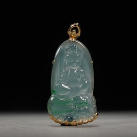 A CARVED JADEITE PENDANT OF GUANYIN