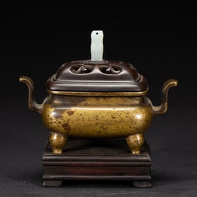 A BRONZE-GILT INCENSE BURNER