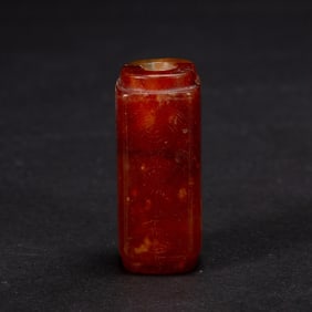 A CARVED AGATE BEAD