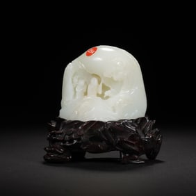 A CARVED WHITE JADE DECORATION