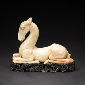 A CARVED SHOUSHAN STONE HORSE