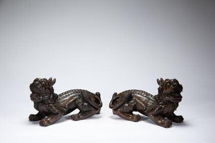 PAIR CARVED ALOESWOOD MYTHICAL BEASTS