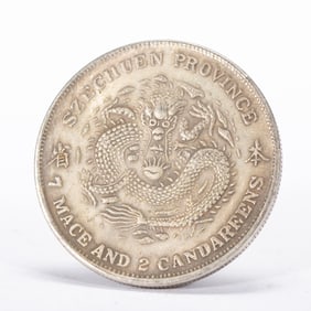 A CHINESE SILVER COIN