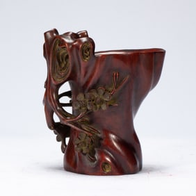 A CARVED ANATTO-WOOD LIBATION CUP