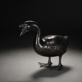 A BRONZE GOOSE-FORM DECORATION