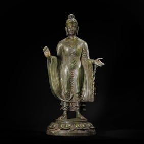 A BRONZE STANDING SHAKYAMUNI