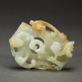 A CARVED WHITE JADE CHILONG ORNAMENT SHE