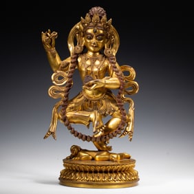 A BRONZE-GILT FIGURE OF DAKINI
