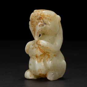 A CARVED WHITE JADE BEAST