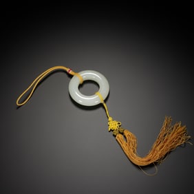 A WHITE JADE RING HUAN