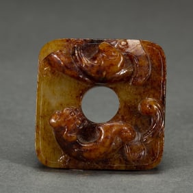 A CARVED JADE ORNAMENT