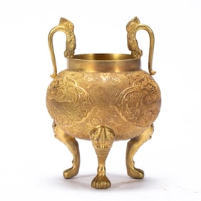 A BRONZE-GILT TRIPOD VESSEL