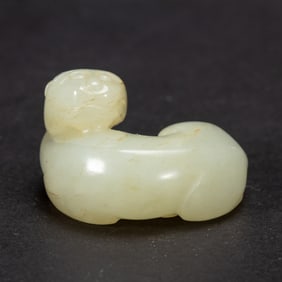 A CARVED WHITE JADE BEAST