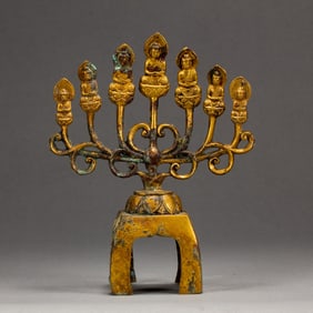 A RARE BRONZE-GILT SEVEN BUDDHAS VOTIVE GROUP