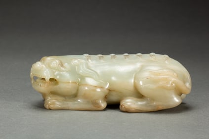 A CARVED WHITE JADE BEAST