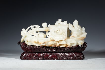 A CARVED WHITE JADE BOAT