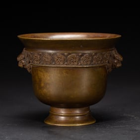 A BRONZE CENSER WITH HANDLES