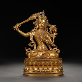 A TIBETAN BRONZE-GILT MANJUSRI