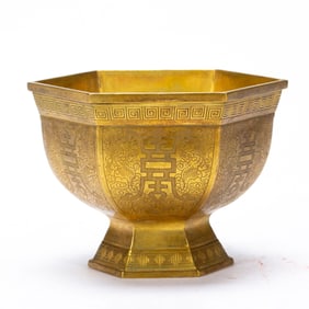 AN INCISED BRONZE-GILT BOWL