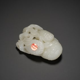A CARVED WHITE JADE LYCHEE