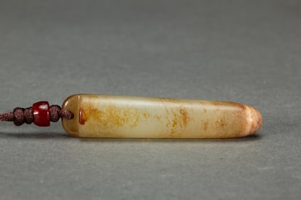 A CARVED JADE ORNAMENT