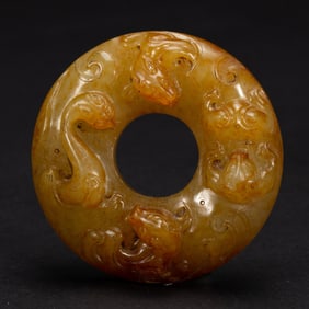 A CARVED CHILONG DISC BI