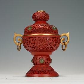A CARVED CINNABAR LACQUER VESSEL WITH COVER