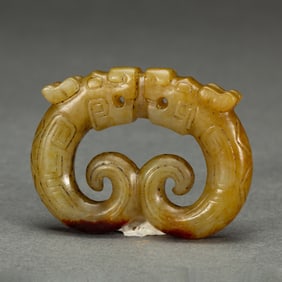 A CARVED JADE DRAGON ORNAMENT
