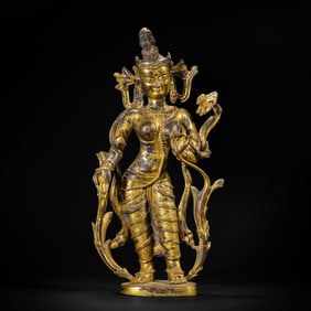 A BRONZE-GILT STANDING PADMAPANI