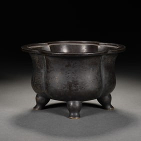 A BRONZE TRIPOD CENSER