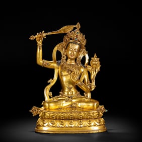A BRONZE-GILT FIGURE OF MANJUSRI