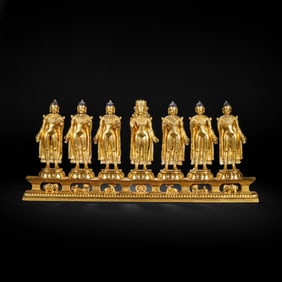 A MAGNIFICENT BRONZE-GILT STANDING BUDDHAS