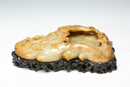 A CARVED WHITE JADE WASHER