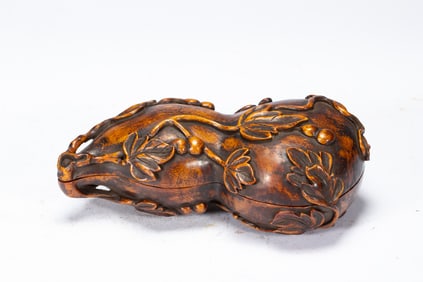 A CARVED HUANGHUALI BOX WITH COVER