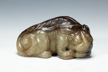 A CARVED JADE MYTHICAL BEAST