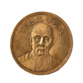A SILVER-GILT COIN