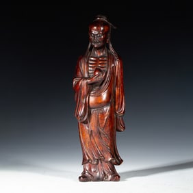 A CARVED ALOESWOOD CHENXIANG STANDING IMMORTAL