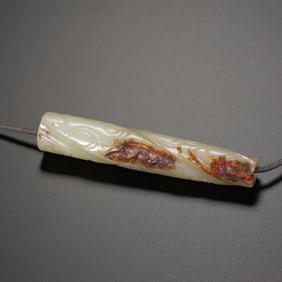 A CARVED WHITE JADE PENDANT