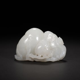 A CARVED WHITE JADE PEACHES
