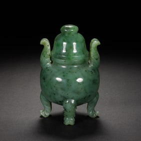 A CARVED JADE TRIPOD CENSER