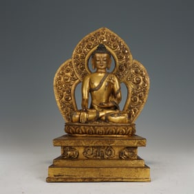 A BRONZE-GILT SEATED SHAKYAMUNI