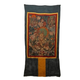 A CHINESE EMBROIDERED THANGKA OF JAMBHALA