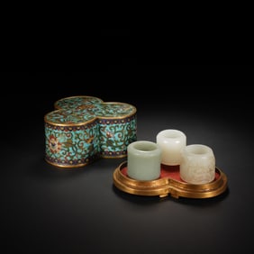A COLLECTION OF JADE ARCHER RINGS