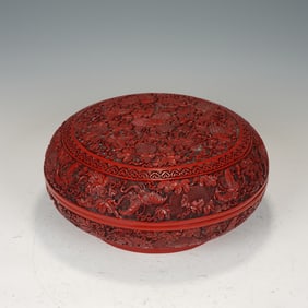 A CARVED CINNABAR LACQUER BOX WITH COVER