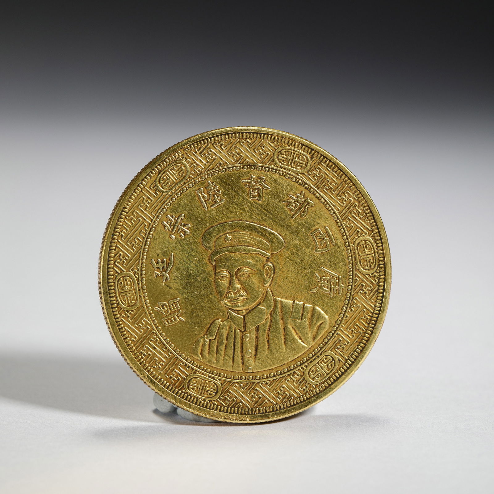 A CHINESE SILVER-GILT COIN (1 of 6)