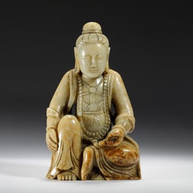 A CARVED JADE GUANYIN