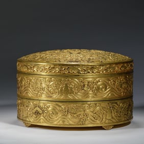 A BRONZE-GILT CIRCULAR BOX WITH COVER